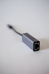 Fototapeta premium Ethernet laptop adapter - type C on a white background