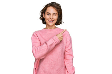 Fototapeta premium Young hispanic woman wearing casual clothes cheerful with a smile on face pointing with hand and finger up to the side with happy and natural expression