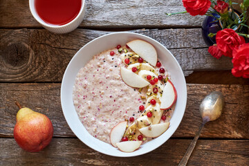 oatmeal with banana, lingonberries and pear.