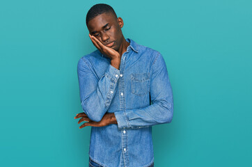 Young african american man wearing casual clothes thinking looking tired and bored with depression problems with crossed arms.