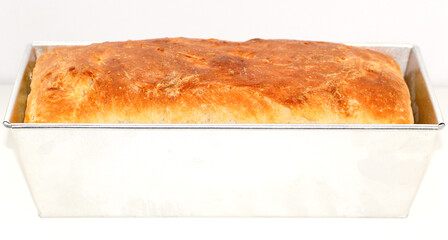 Homemade white wheat bread with a crispy crust. Baking with hand-kneaded yeast dough.
