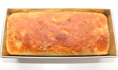 Homemade white wheat bread with a crispy crust. Baking with hand-kneaded yeast dough.