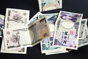 Japanese yen against a black background