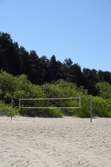 An empty volleyball court on Pirita beach in Tallinn, Estonia. Volleyball net on the beach on a...