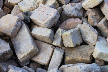 A pile of old bricks after dismantling an old house. Ruins of an old house.