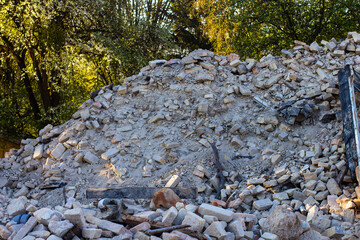 Ruins of an old house. A pile of old bricks after dismantling an old house.