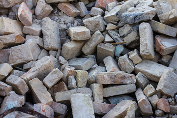 Ruins of an old house. A pile of old bricks after dismantling an old house.