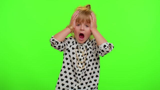 Upset displeased little blonde teen child kid girl raising hands, indignantly asking reason of failure, misunderstanding concept isolated on chroma key background. Childhood quarrel. Young children