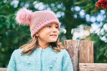 Adorable caucasian child girl smiling happy standing at the park.