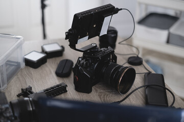 top view of work space photographer with digital camera and camera accessory