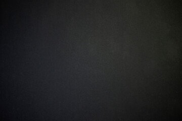 Black paper top view photo for background.