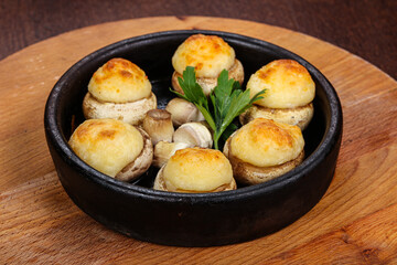 Baked champignon staffed with cheese