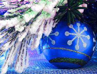 Bright Christmas Ornaments Under the Tree with a Blue Hue