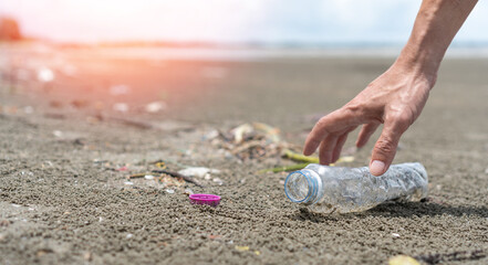 CSR corporate sustainable responsibility concept. Hand of business man picking plastic bottle...