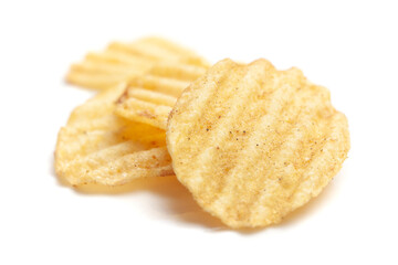 Close up of Wrinkled Wavy Potato Chips, Popular Ready to eat crunchy, salty pale-yellow color over white background