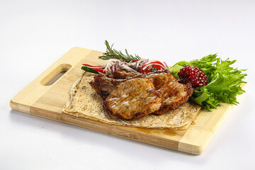 Grilled pork loin served onion