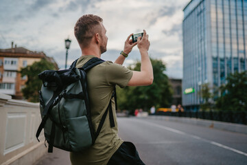 handsome hipster man walking in street