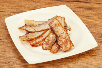Roasted juicy bacon in the plate