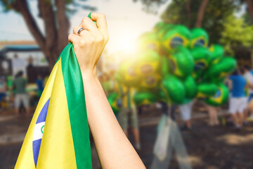 Man holding flag at street demonstration against corruption in Brazil. Concept democracy image with space text. - obrazy, fototapety, plakaty