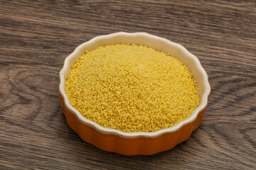 Raw cous cous heap in the bowl
