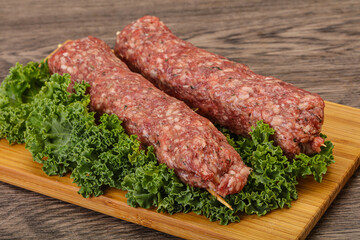 Raw minced beef kebab skewer