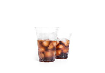 Soda with ice in a transparent plastic glasses isolated on a white background.