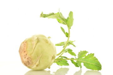 One ripe organic kohlrabi cabbage, close-up, isolated on white.