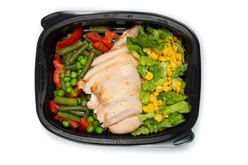 Ready food in a container. Stewed chicken, stewed vegetables.