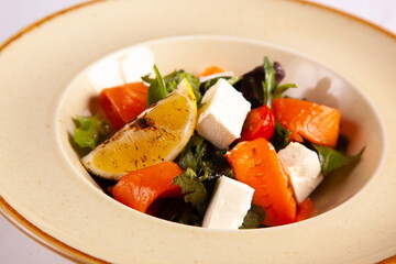 Salad with red fish and soft cheese