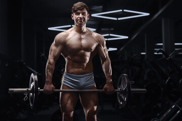 athletic man exercising pumping up biceps muscles