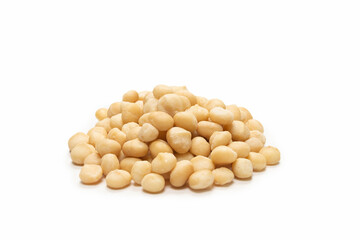 Macadamia nuts isolated on white background.