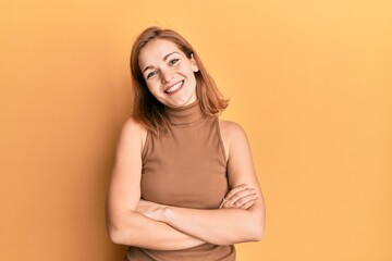 Obraz premium Young caucasian woman wearing casual style with sleeveless dress happy face smiling with crossed arms looking at the camera. positive person.