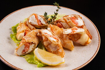 Pancakes with different filling in a plate