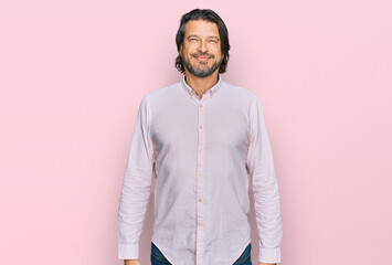 Middle age handsome man wearing business shirt with a happy and cool smile on face. lucky person.