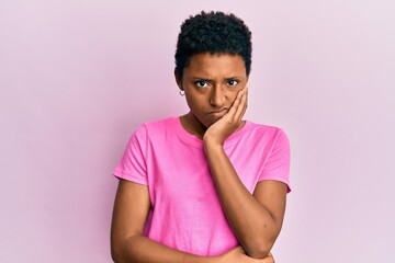 Young african american girl wearing casual clothes thinking looking tired and bored with depression problems with crossed arms.