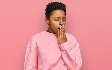 Fototapeta na wymiar Young african american woman wearing casual clothes bored yawning tired covering mouth with hand. restless and sleepiness.