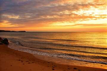 Fototapeta na wymiar Sunset over Atlantic Ocean in Cape Breton, Nova Scotia, Canada