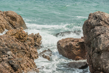 Waves crashing on the rocks.