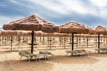 Palm umbrellas on the beach in Pescara (Abruzzo-Italy)