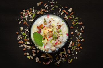Close-up of Creamy rice Kheer(khir) Garnished with basil leaf, saffron and dry fruits. Indian...