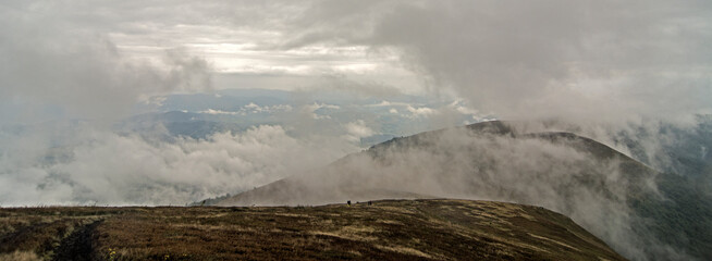 highland mountain meadows with mist and clouds