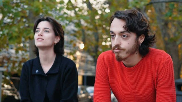 talkative woman - young man exhausted by his friend's speech