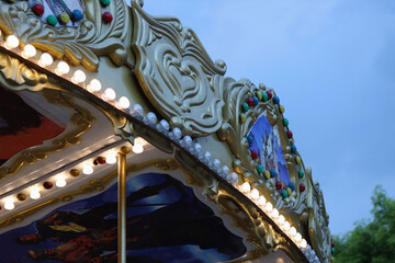 Children's attractions in the theme park. Screaming, laughing and having fun together on summer vacation.