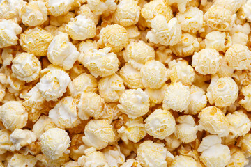 Fresh, sweet popcorn with caramel close-up, top view