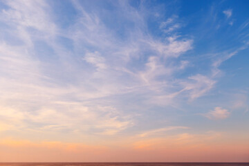 Naklejka na ściany i meble Beautiful evening sky with translucent cirrus clouds