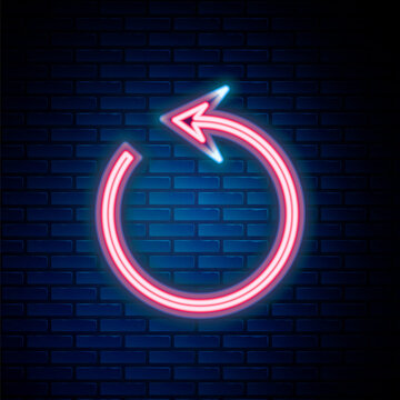 Glowing neon line Refresh icon isolated on brick wall background. Reload symbol. Rotation arrow in a circle sign. Colorful outline concept. Vector