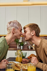 Fototapeta na wymiar Happy same-sex young male couple kissing