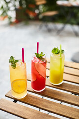 glass of refreshing cocktail on the table on terrace 