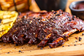 Ribs served on wooden plate in american restaurant