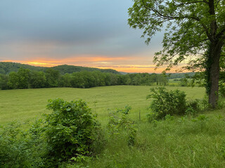 Sunset over green valley